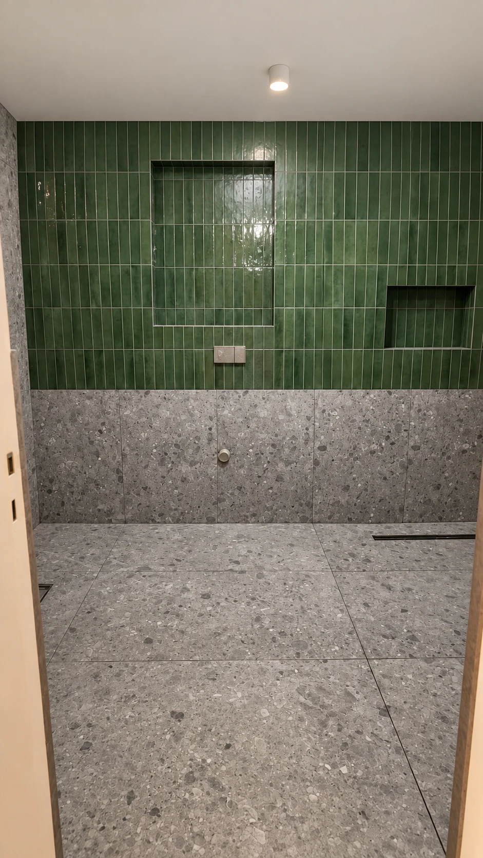 Green glazed tile and terrazzo in the bathroom