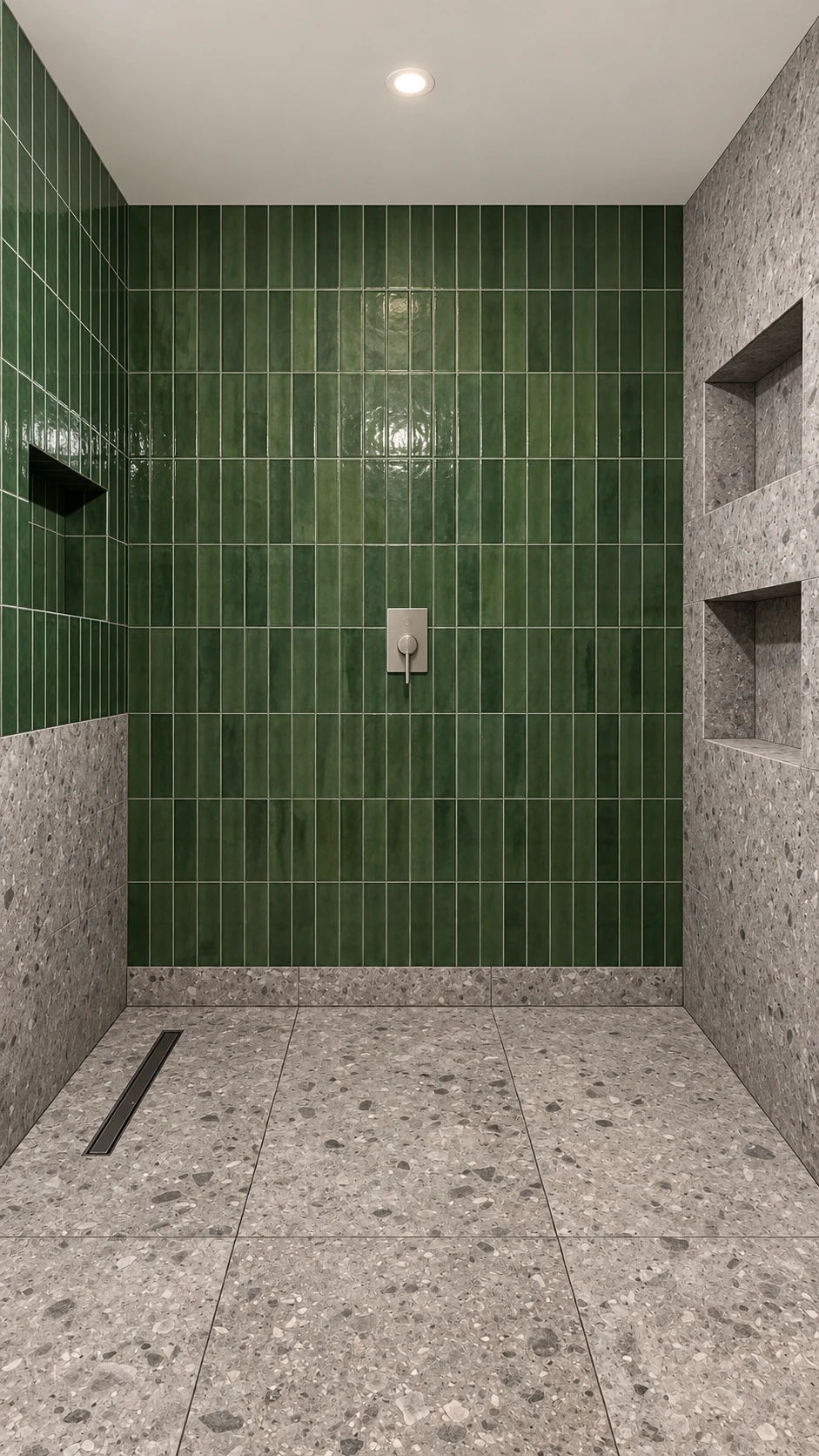 Green glazed tile and recessed terrazzo shelving in the shower room